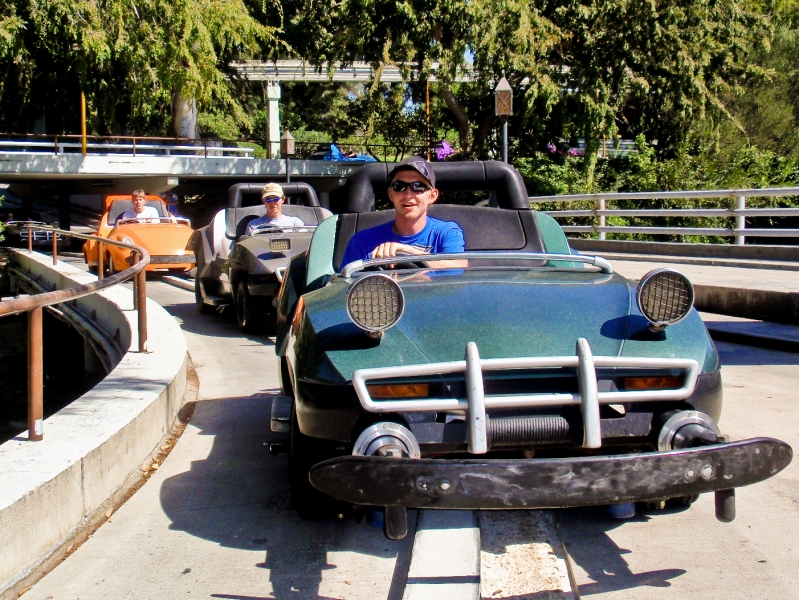 Disney2009 107.jpg - Eric, Greg and Nicholas driving cars at the Autopia